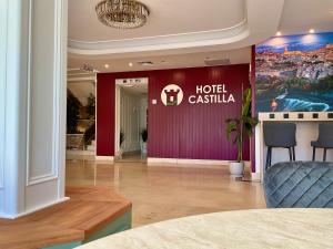 a hotel castilla lobby with a sign on the wall at Hotel Castilla Torrijos in Torrijos +85 photos