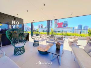 a living room with a view of a city at Move - Tambaú in João Pessoa