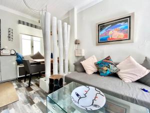 a living room with a couch and a table at Apollo House in Lefkada