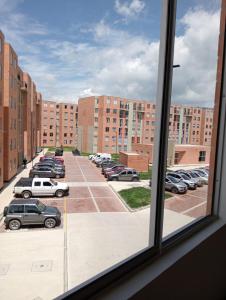 a view from a window of a parking lot at Apartamento Urban Paipa in Paipa
