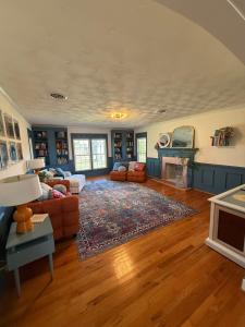 a living room with a couch and a fireplace at The Joyful Escape in Crewe