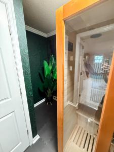 a door to a room with a plant in it at The Joyful Escape in Crewe +65 photos