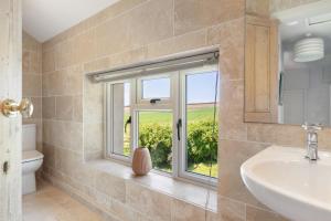 a bathroom with a sink and a window at 2 Bed in St. Brides oc-s30491 in Saint Brides +20 photos