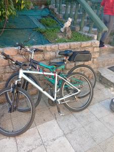 a bike parked next to a stone wall at A casiña de Morais in Pontevedra