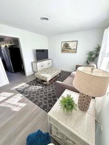 a living room with a couch and a table at Crewe Corner Apartment C in Crewe