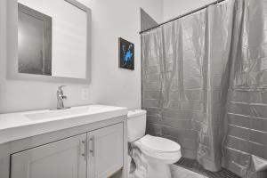 a bathroom with a toilet and a sink and a shower at Music Soul House in Atlanta +8 photos