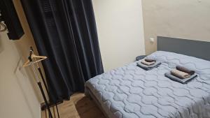 a bedroom with a bed with black curtains at Guest house Di Carlo in Sulmona