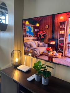 a living room with a couch in a mirror at Avida Tower 2 in Davao City