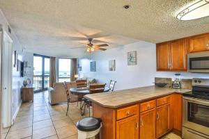 a kitchen with a table and a dining room at SunDestin Resort Unit 0615 in Destin