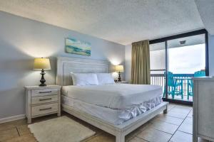 a bedroom with a bed and a balcony at SunDestin Resort Unit 0615 in Destin +63 photos
