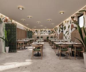 a restaurant with tables and chairs and plants at Gradska Palača - BOSANA Hotel & Spa in Bihać