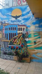 a mural of a peacock on the side of a building at Hostel Mar in São Luís