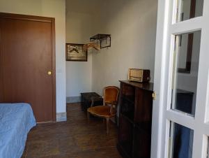 a bedroom with a bed and a basketball hoop on the wall at Casa Del Colle in Casasco