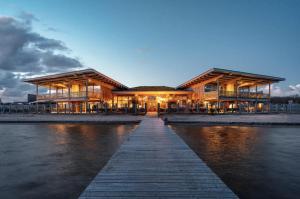 a large building on the water at night at Studio Waterfront | 2 Pers. in Ouddorp