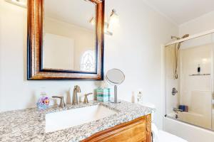 a bathroom with a sink and a mirror at Nubble's Perch in York +22 photos