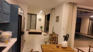 a kitchen and living room with a table and chairs at Zenna villa long Hải in Bà Rịa +1 photo