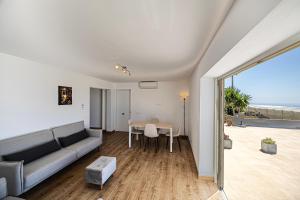 a living room with a couch and a table at Villa Las Norias in Tazacorte