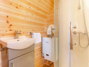a small bathroom with a sink and a shower at 1 Bed in Conwy oc-95222 in Conwy