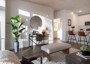 a living room with a table and chairs and a mirror at The Lakeview Guesthouse in Duluth