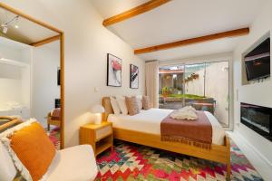 a bedroom with a bed and a large window at Douro Prestige Urban Retreat with shared S-Pool & Gym in Porto