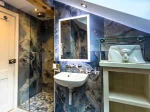 a bathroom with a sink and a mirror at NoTwenty9 Bar and Restaurant in Burnham Market +35 photos