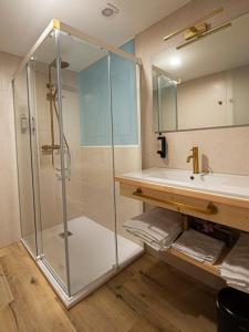 a bathroom with a shower and a sink at A Casa do Tella e Rosalía in Portosin +7 photos