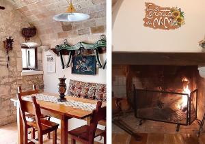 a dining room with a table and a fireplace at La grotta di NiMa in Pretoro