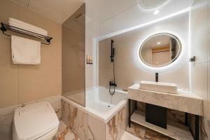 a bathroom with a toilet and a sink and a mirror at 신림 빌라드보니 villa de boni in Seoul +78 photos