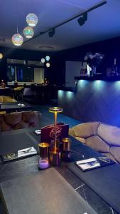 a room with a table with candles and lights at Orient Herent - Boetiekhotel in Herent