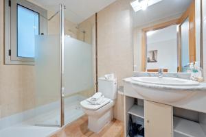 a bathroom with a sink and a toilet and a shower at Hauzify I Apartaments Bellaire in Blanes