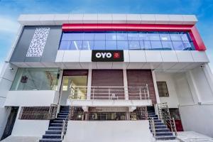 a building with an ovo sign on the front of it at HOTEL O SAMRAT INN in Prayagraj +22 photos