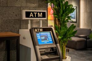 an atm machine with an atm sign on it at Nesto Hongdae in Seoul