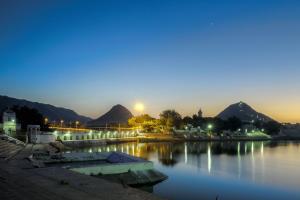 a view of a body of water at night at Hotel Pushkar Legacy in Pushkar