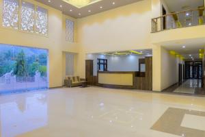 an empty lobby with a pool in a building at Hotel Pushkar Legacy in Pushkar