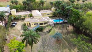 an aerial view of a house with a swimming pool at Pousada Vila Leopoldina in Tiradentes