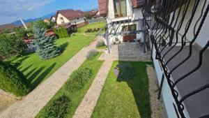 an external view of a house with a fence at Casa Stefu in Râşnov +49 photos