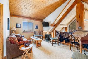 a living room with a couch and a piano at Tetro Rock Retreat in Deadwood