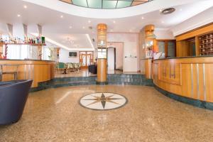 a lobby of a bar with a star on the floor at Hotel Metropole in Rimini +80 photos