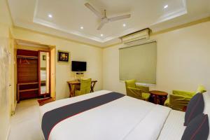 a hotel room with a bed and a chalkboard at Open Hotel by Olive - Ashok Nagar in Chennai