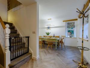 a dining room with a table and chairs at 3 Bed in Llandysul oc-90019 in Llandyssiliogogo