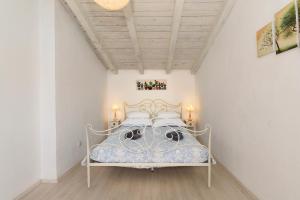 a bedroom with a bed with a hello kitty comforter at Casablanca-Brgulje in Brgulje