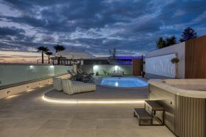a house with a swimming pool on a roof at AZURE Seaside Residence in Kokkini Khanion +32 photos