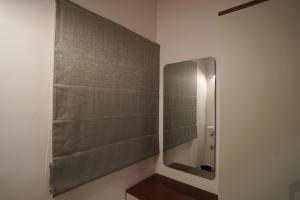 a bathroom with a shower with a mirror at YR sea resort in Pāmban +48 photos