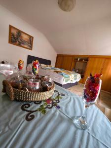 a room with a table with food and a glass at Stan na dan Cazin in Cazin