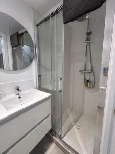a bathroom with a shower and a sink at Fabulous 2 bed-townhouse with large rooftop! in Estepona +31 photos