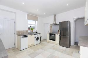 a kitchen with a stainless steel refrigerator and a dishwasher at Durham 5BR Contractors Long Stay Discounts in Murton