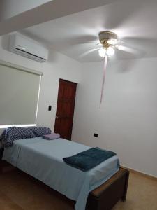 a bedroom with a ceiling fan and a bed at SN2 Loft for 2 people, private bathroom in Monterrey