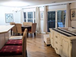 a kitchen and dining room with a table and chairs at Premium 3 Bed Top Floor Views in Vernon Township