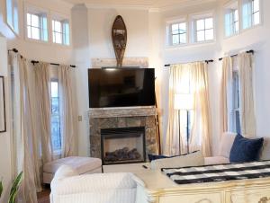 a living room with a fireplace and a tv at Premium 3 Bed Top Floor Views in Vernon Township