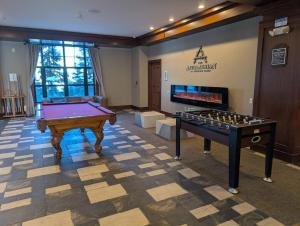 a billiard room with a pool table and avertisement at Country Charm 1 Bd Balcony Views in Vernon Township
